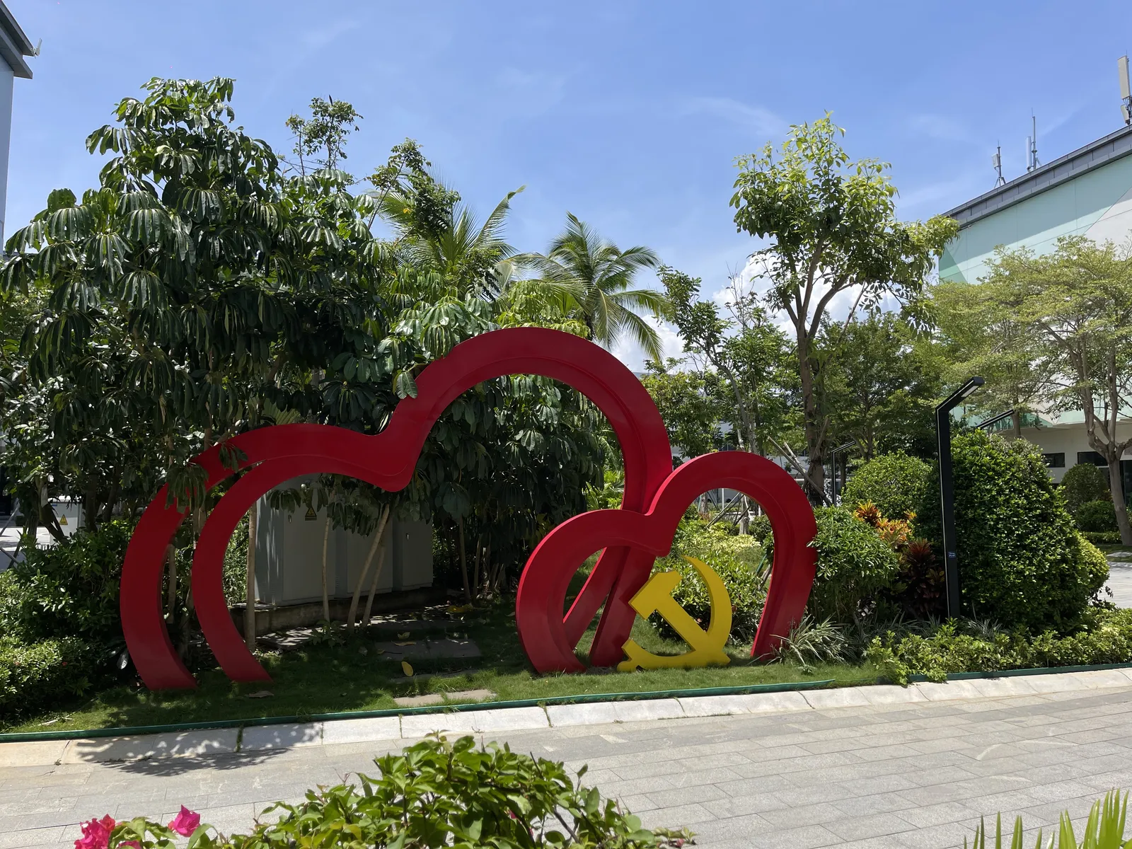 Outdoor greenery and incubator sign near the building